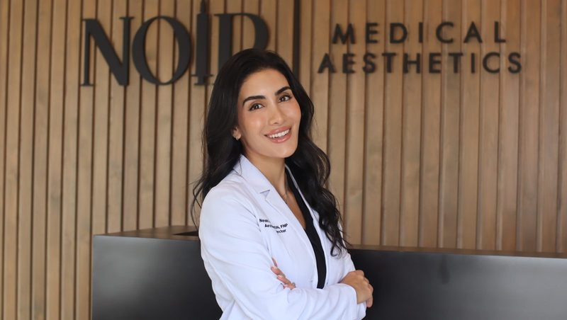 Neeki Ostad, founder of Noir Medical Aesthetics, in a white lab coat